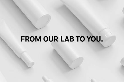 Svart text From our lab to you med flera vita tuber i bakgrunden.